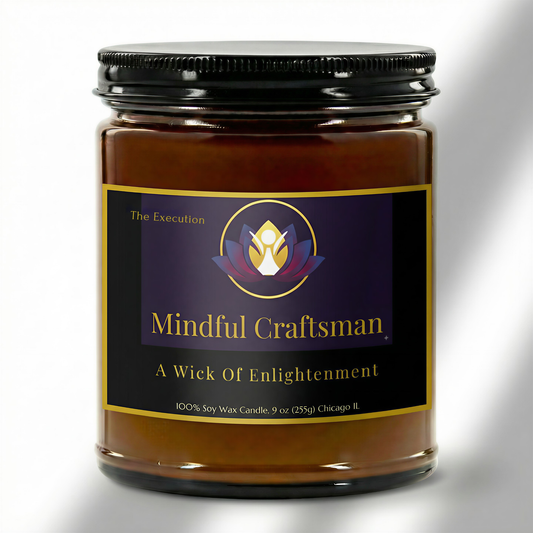 A premium 9oz hand-poured candle in an amber jar, displaying the Mindful Craftsman logo and 'The Execution' scent name in elegant gold text.