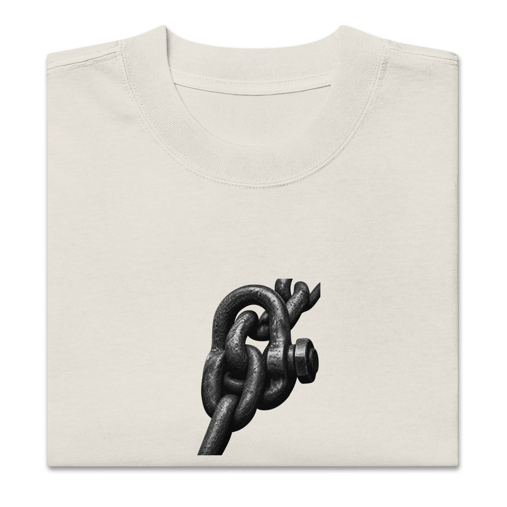 Folded faded bone oversized t-shirt showing the crewneck collar and printed chain link graphic.