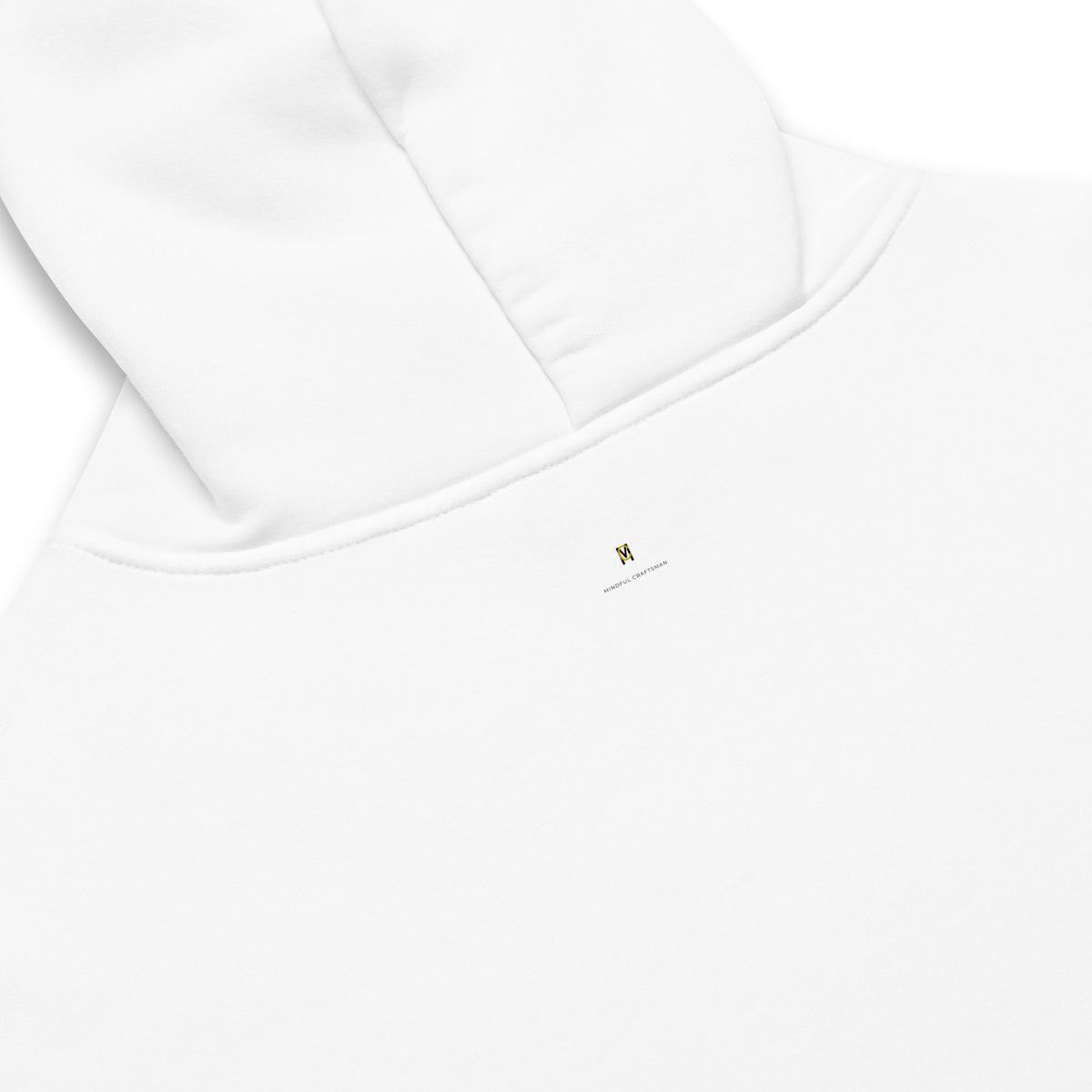 Close-up detail of the upper back neckline and hood of a white hoodie showing the small Mindful Craftsman logo.